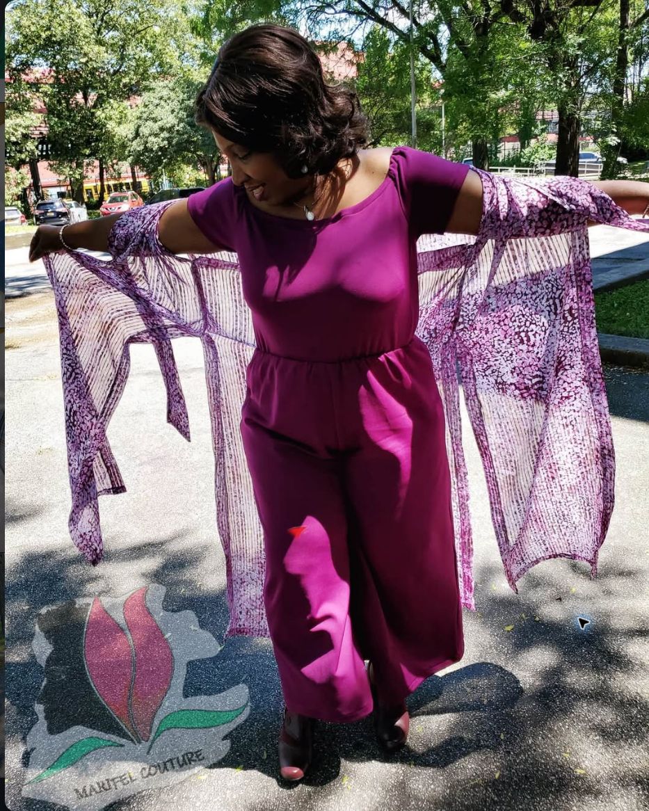 Marie Felix, the designer behind MariFel Couture, wearing her own purple custom outfit